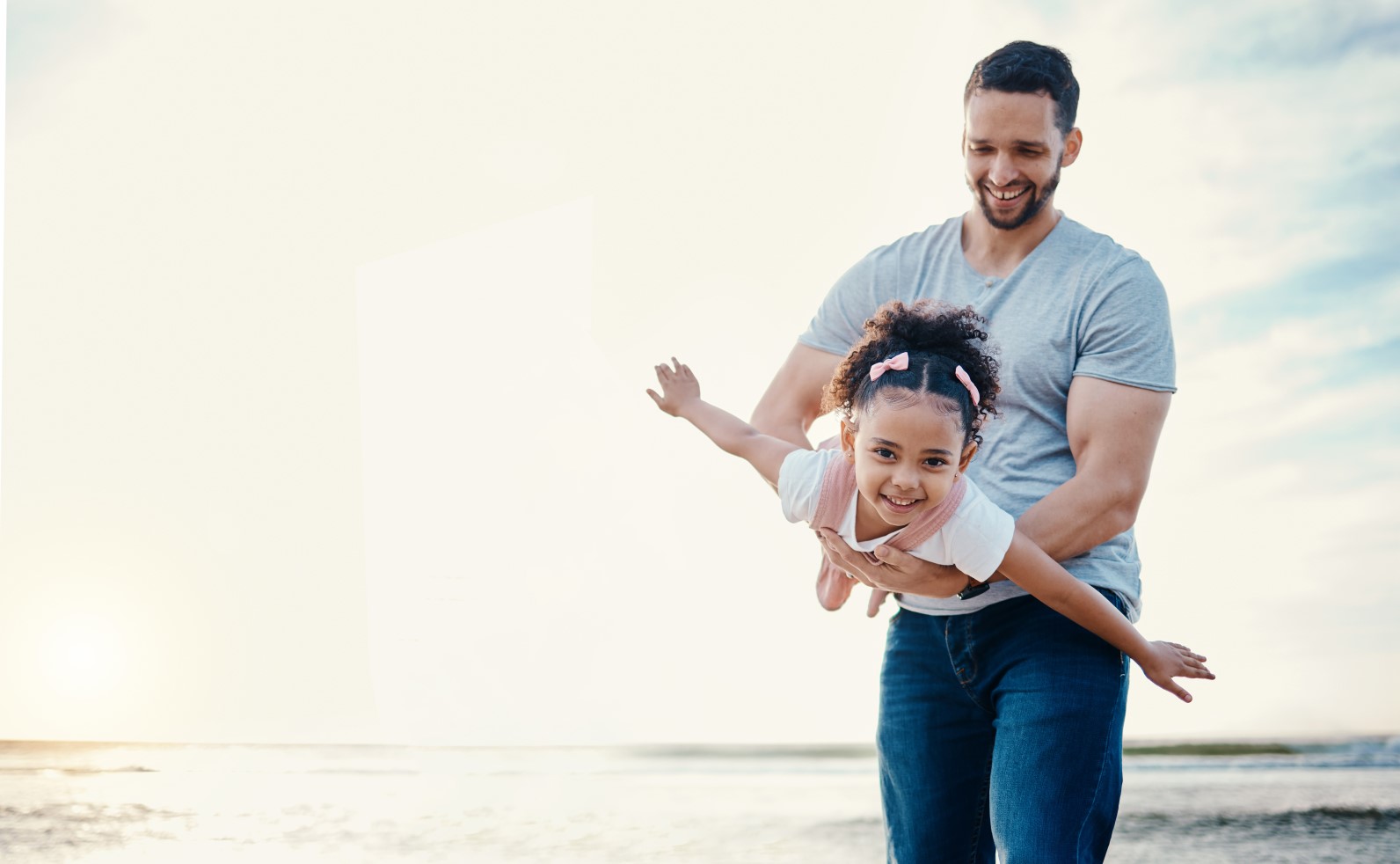 Airplane, kid and father at beach with family